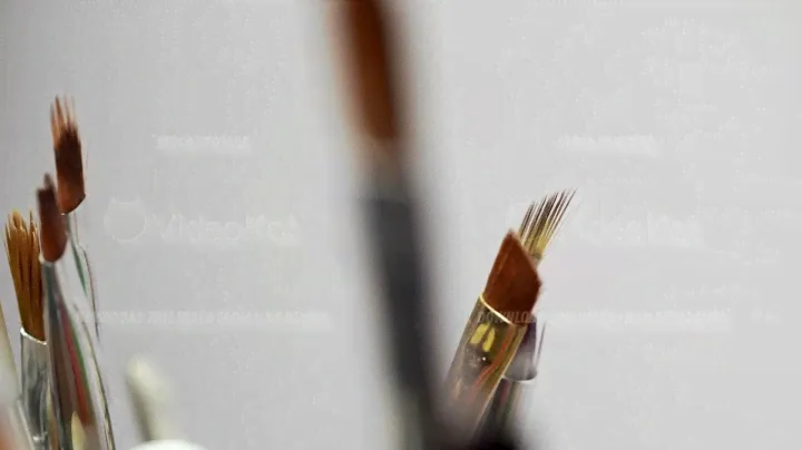 Macro view of different professional makeup brushes filmed on white background